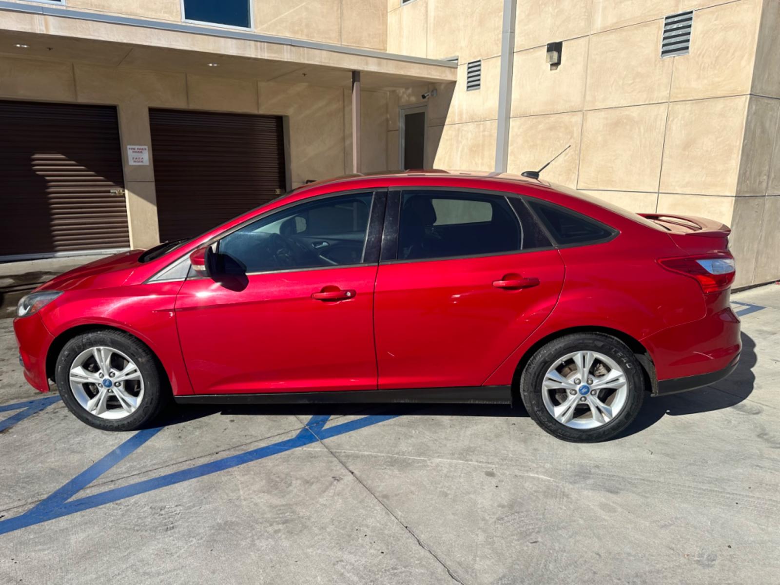2012 RED /BLACK Ford Focus SE Sedan (1FAHP3F29CL) with an 2.0L L4 DOHC 16V engine, AUTOMATIC transmission, located at 30 S. Berkeley Avenue, Pasadena, CA, 91107, (626) 248-7567, 34.145447, -118.109398 - New Tires! Nice Interior! drives and looks good! Bad credit? We can help! We are the bank. All our cars are thoroughly inspected and reconditioned by our technicians. FREE CARFAX report. Stop by or call to speak with our friendly staff. Whether you have bad credit, no credit, bankruptcy, or reposse - Photo #1